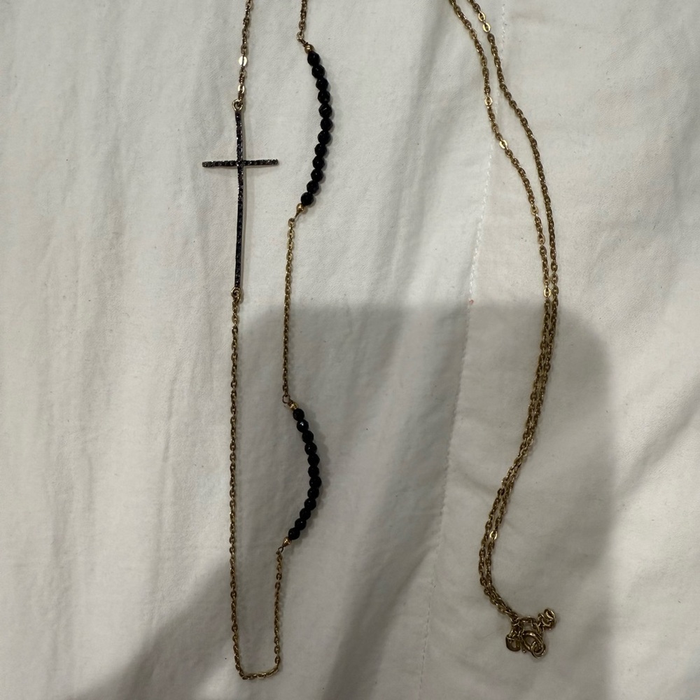 Elegant Gold and Black Cross Necklace